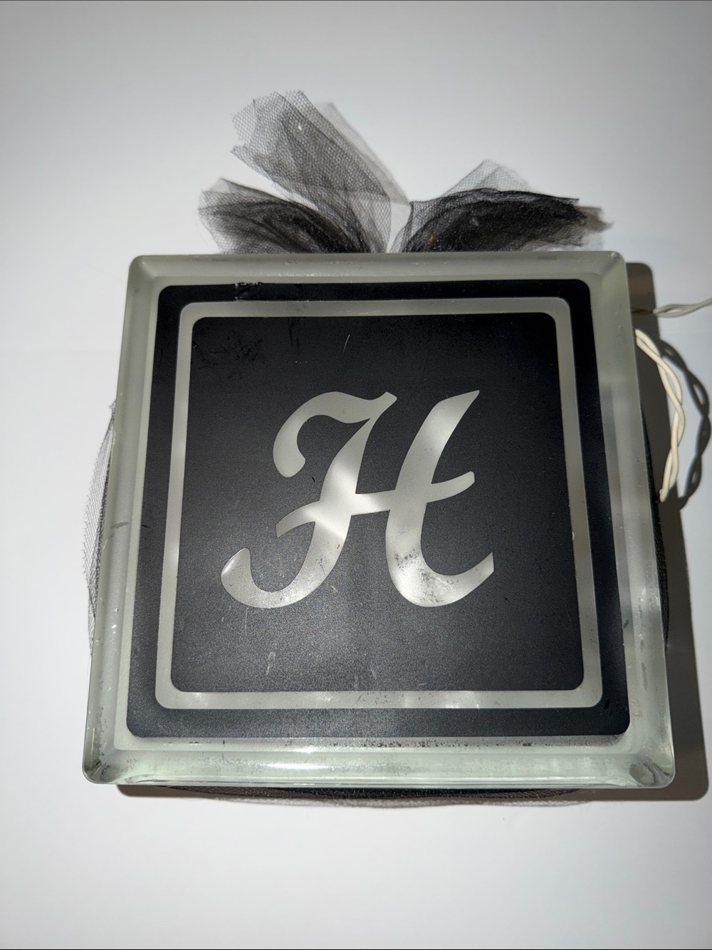 Custom made initial โHโ glass lighted block